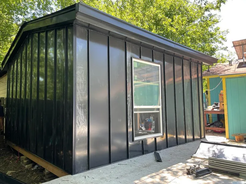 Black standing seam metal wall panels for Roof Inspection in Burien